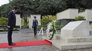 Japanese Prime Minister Shinzo Abe having a moment of silence after the laying of the wreath