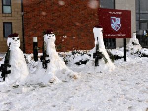 Soldiers and Officers from 16 Air Assault Brigade, build snow men during their Naafi break.